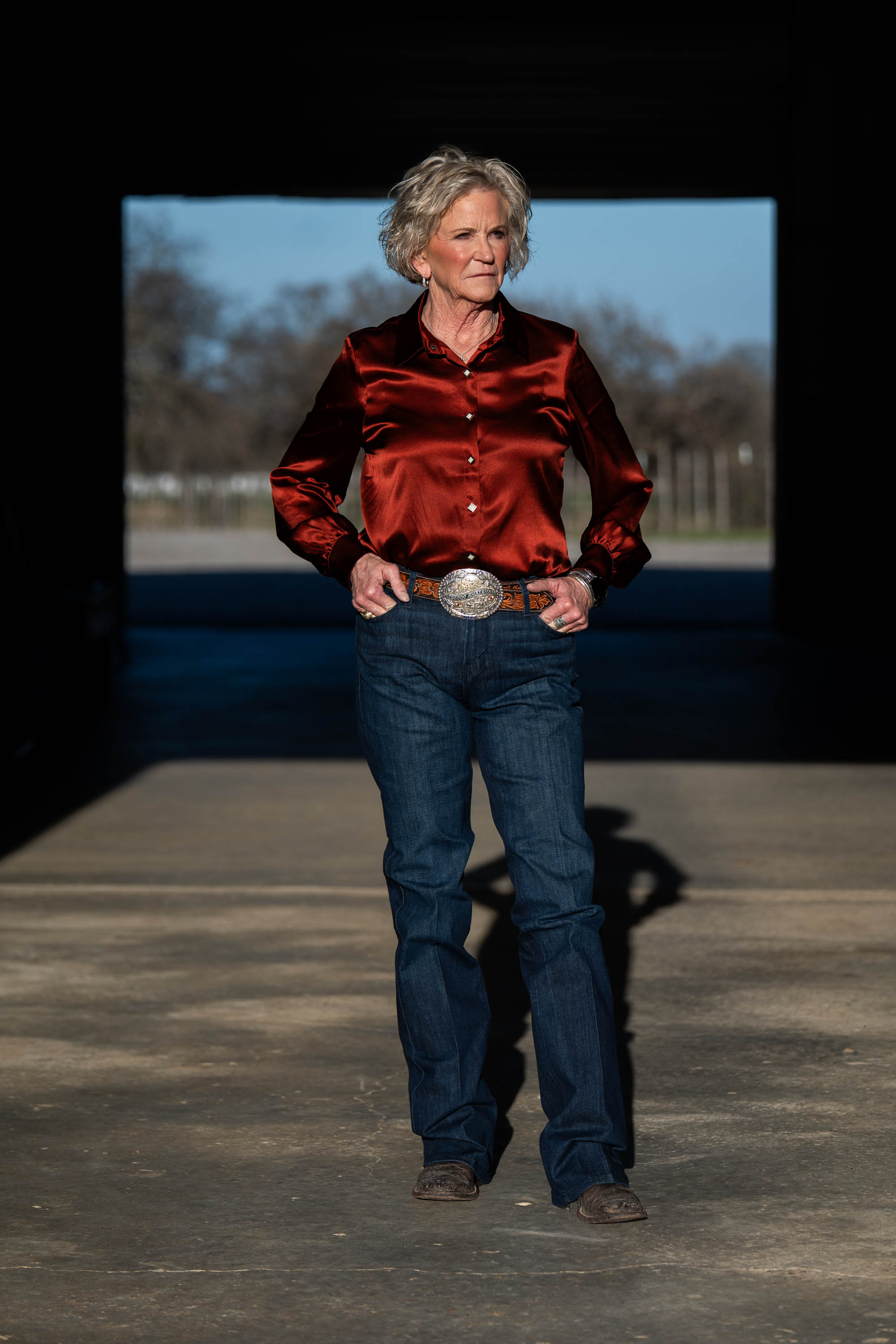 Sharon Beach in red satin shirt with championship belt buckle